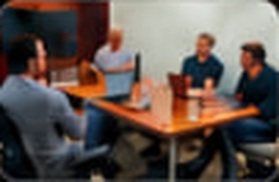 Team workshop around a table at the Delhi Tech Lab